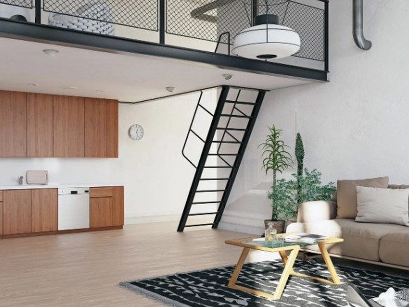 Local reconvertido en vivienda tipo loft con altillo, cocina abierta y suelo de madera